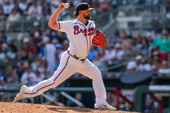 Aug 20, 2023; Cumberland, Georgia, USA; Atlanta Braves relief pitcher Kirby Yates (22) pitches against the San Francisco Giants during the ninth inning at Truist Park.